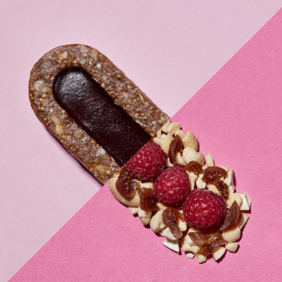 Creative Geometric Pink Food Photography Of A Bunch Bar With Raspberry Flavour