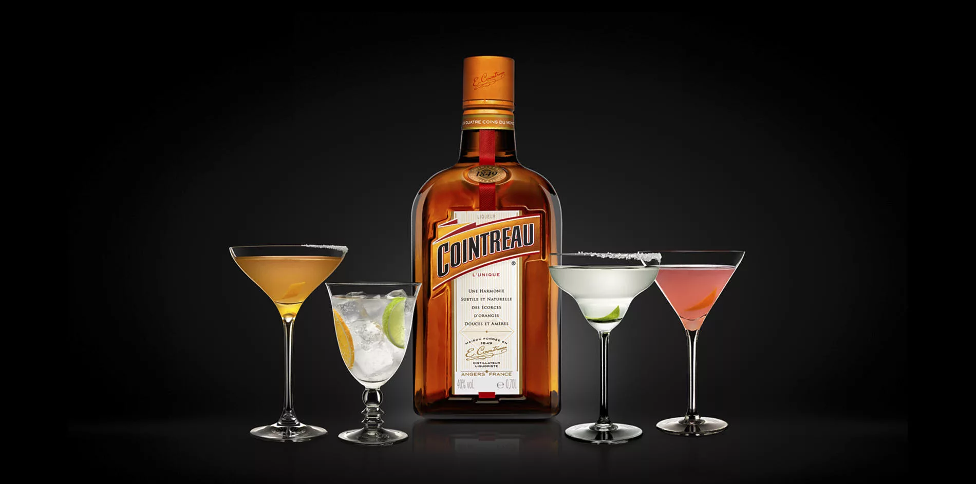 four cocktails with styling and a bottle of cointreau in the middle