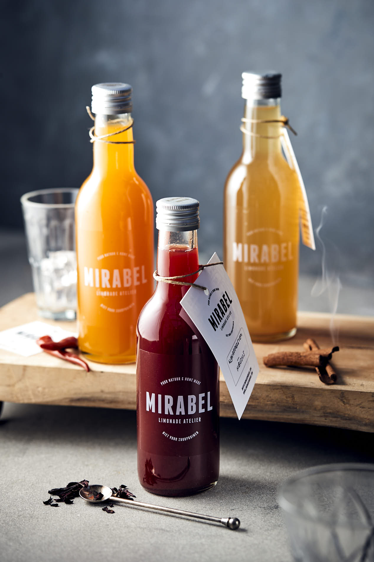 food photo by French Beans of three bottles Mirabel syrup in a cosy setting