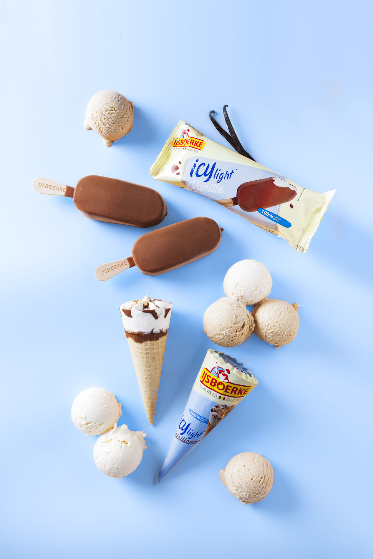 Food Photography Scoops Of Ice Cream And Ice Cream Cones On A Blue Background