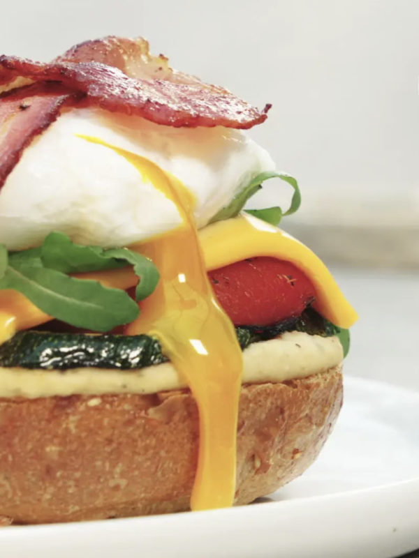 Still From Recipe Video Of A Sandwich With Grilled Vegetables Bacon And Poached Egg